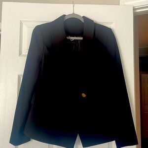 Black double breasted blazer. No pockets. Classic fit.